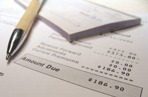 Ballpen on top of an invoice